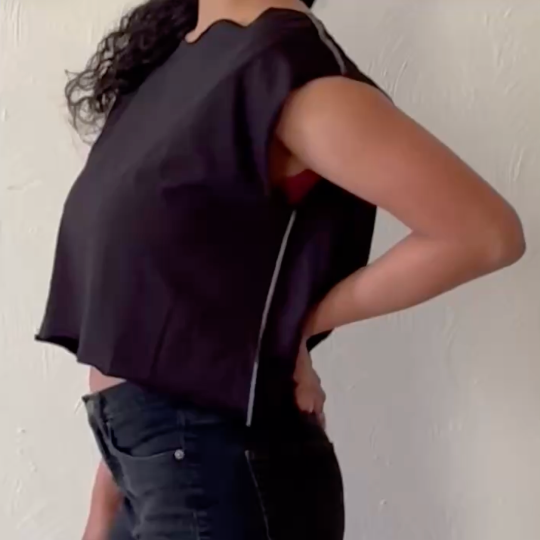 Model wearing Addie Cropped Muscle Tee, side view