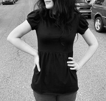 black cotton modal cap sleeve babydoll tee front on model